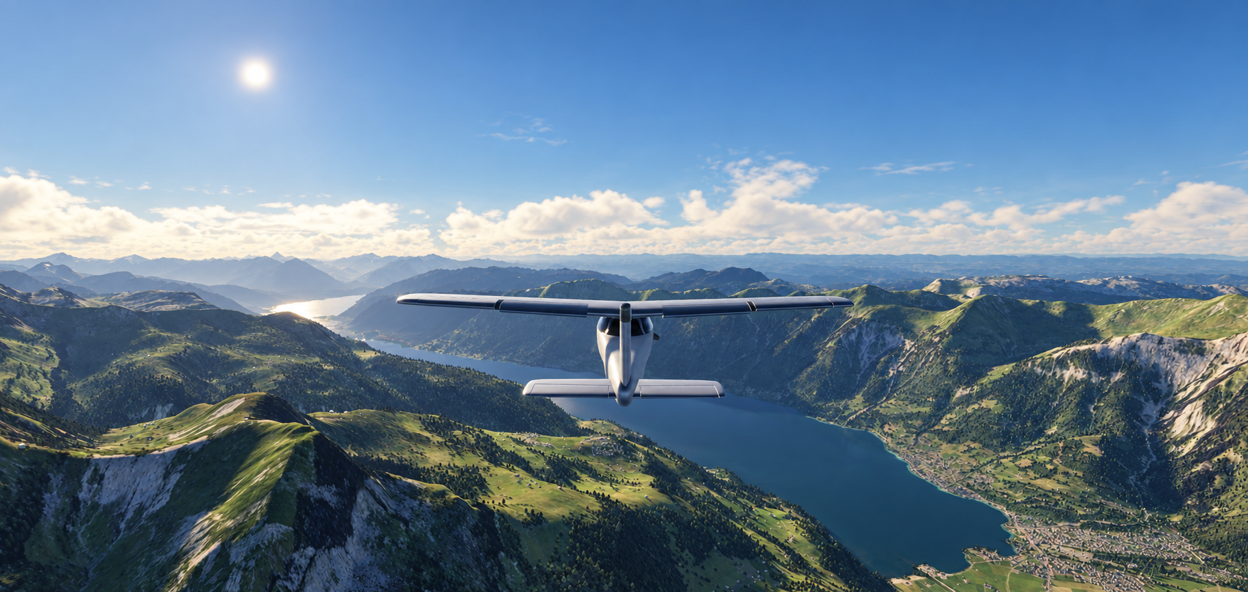 OleoFlight aircraft flying over an Alpine lake and mountains